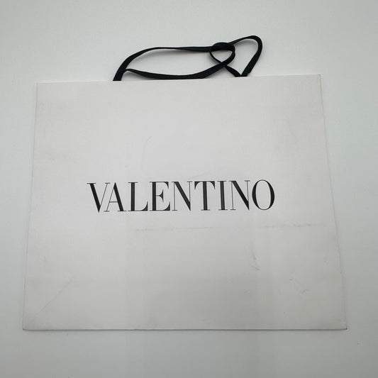 Valentino shopping bag on a white surface