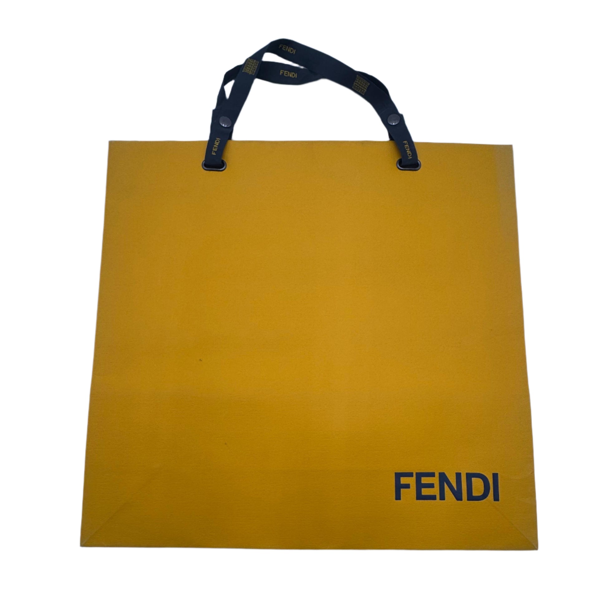 Yellow Fendi shopping bag on a white surface
