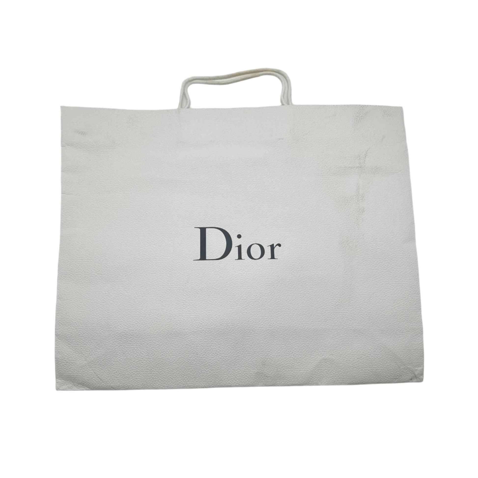 Dior branded pouch inside an open white box