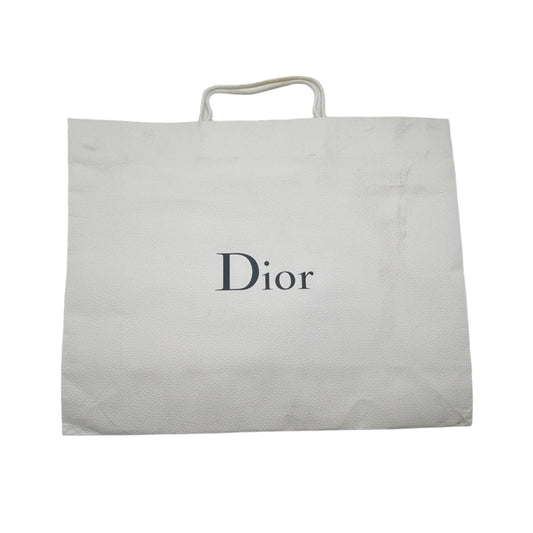Dior branded pouch inside an open white box