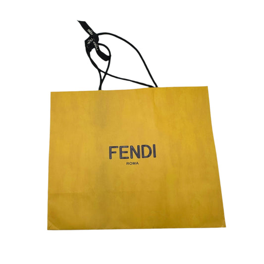 Yellow Fendi bag on a white background