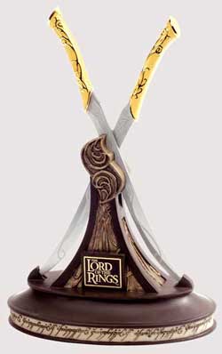 Sword with gold hilt on a wooden base with 'The Lord of the Rings' logo