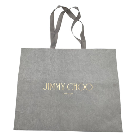 Gray tote bag with 'Jimmy Choo' logo on a white background