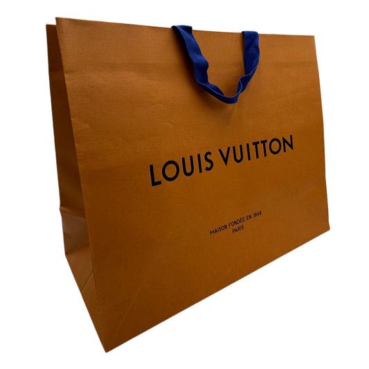 Louis Vuitton paper bag with blue handle on a white background