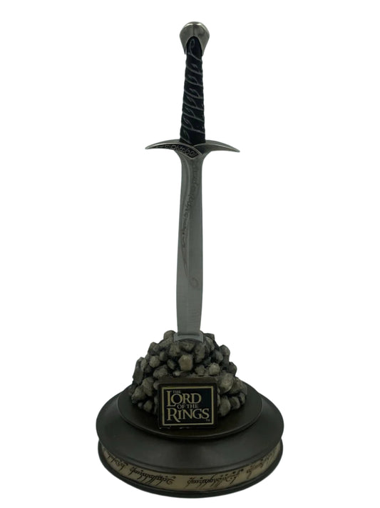 Sword model with decorative base on a white background